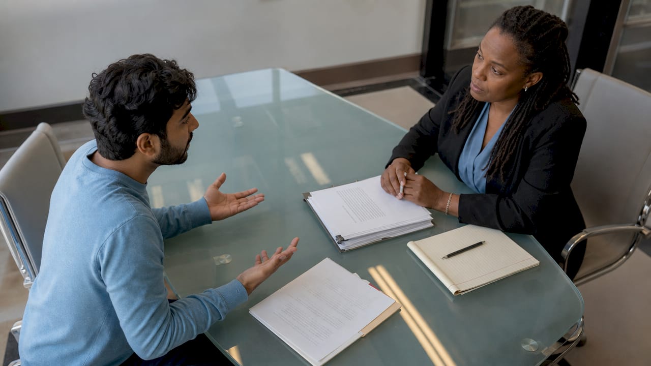 Client consulting attorney about assault charge