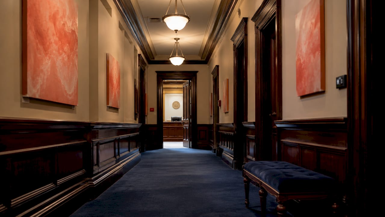 Empty courthouse hallway symbolizing record duration