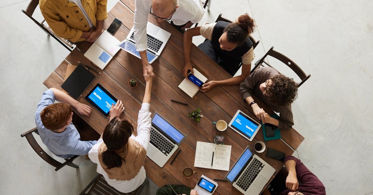 Modern office workers use tablets and laptops together