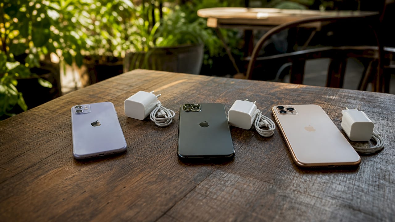 Overhead close-up of three iPhone 11 models side by side