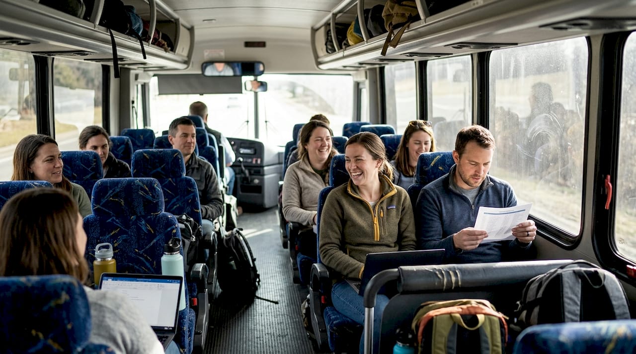 Group inside charter bus preparing for event