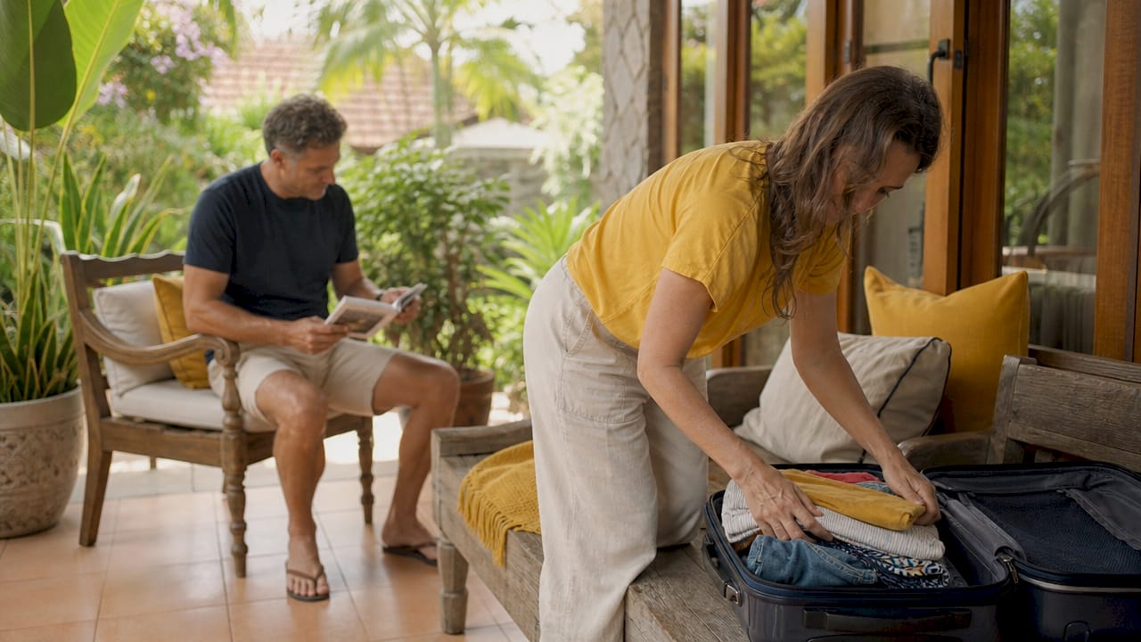 Couple unpacking at vacation rental villa