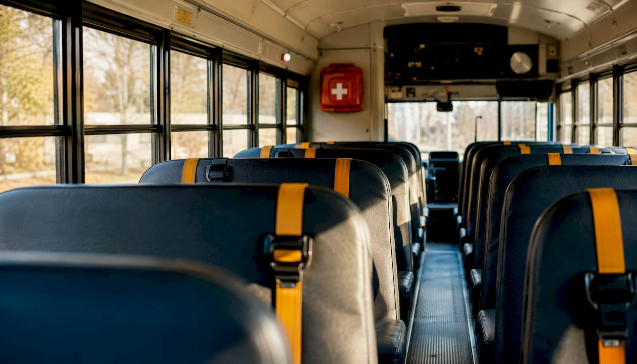 Empty Canadian school bus interior with safety seats