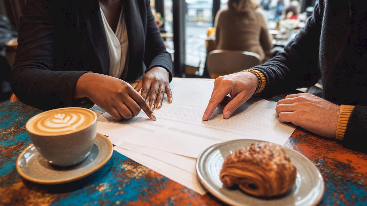 Hands comparing transport provider contracts