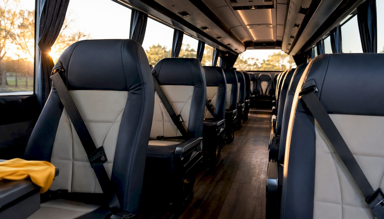 Motor coach bus interior with safety seat belts