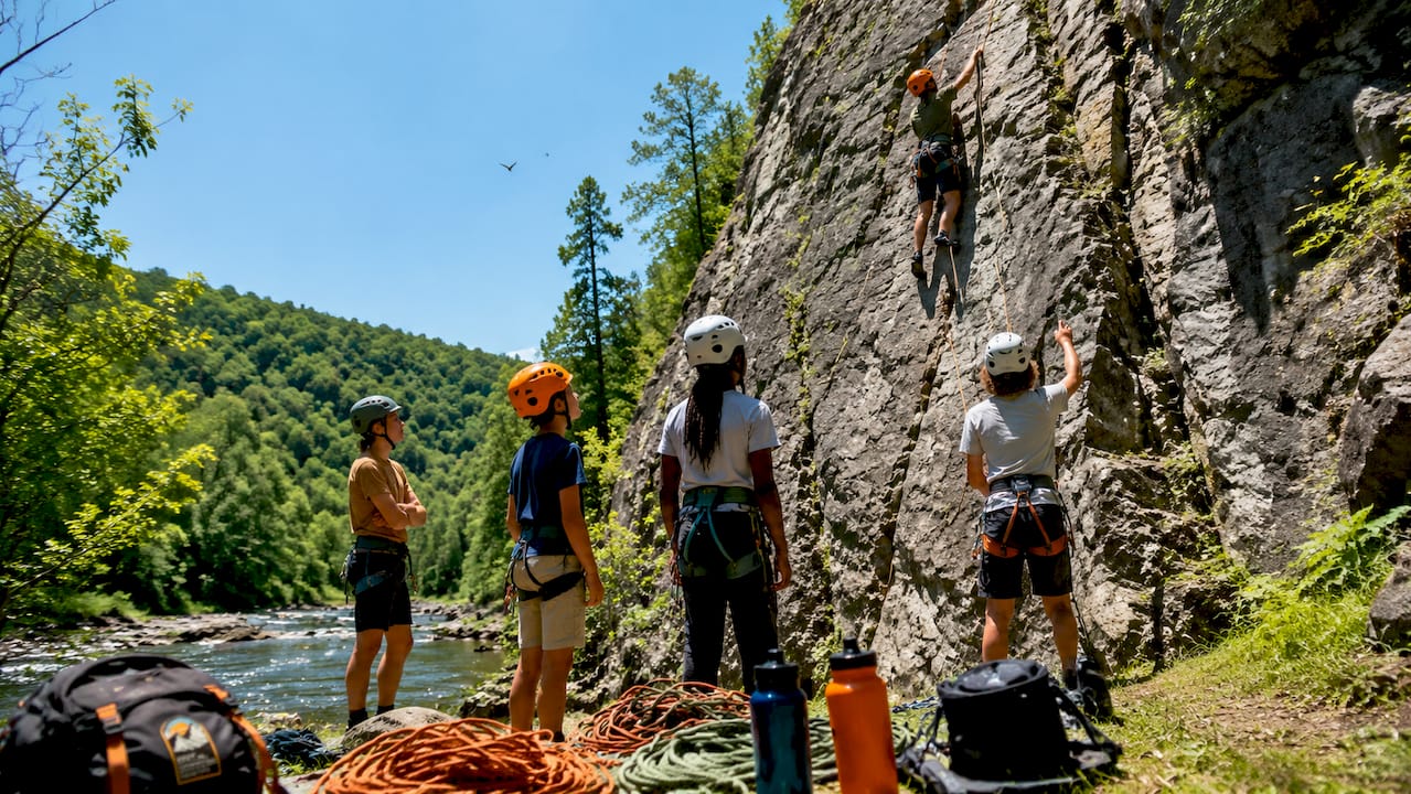 Role of Confidence Building in Teens: 2026 Guide 3 Teens rock climbing outdoors teamwork