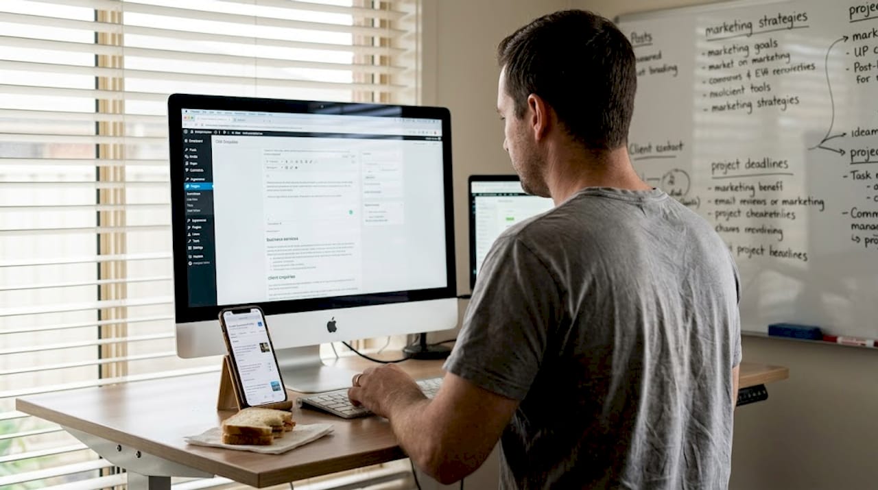 Man updating business website and profile