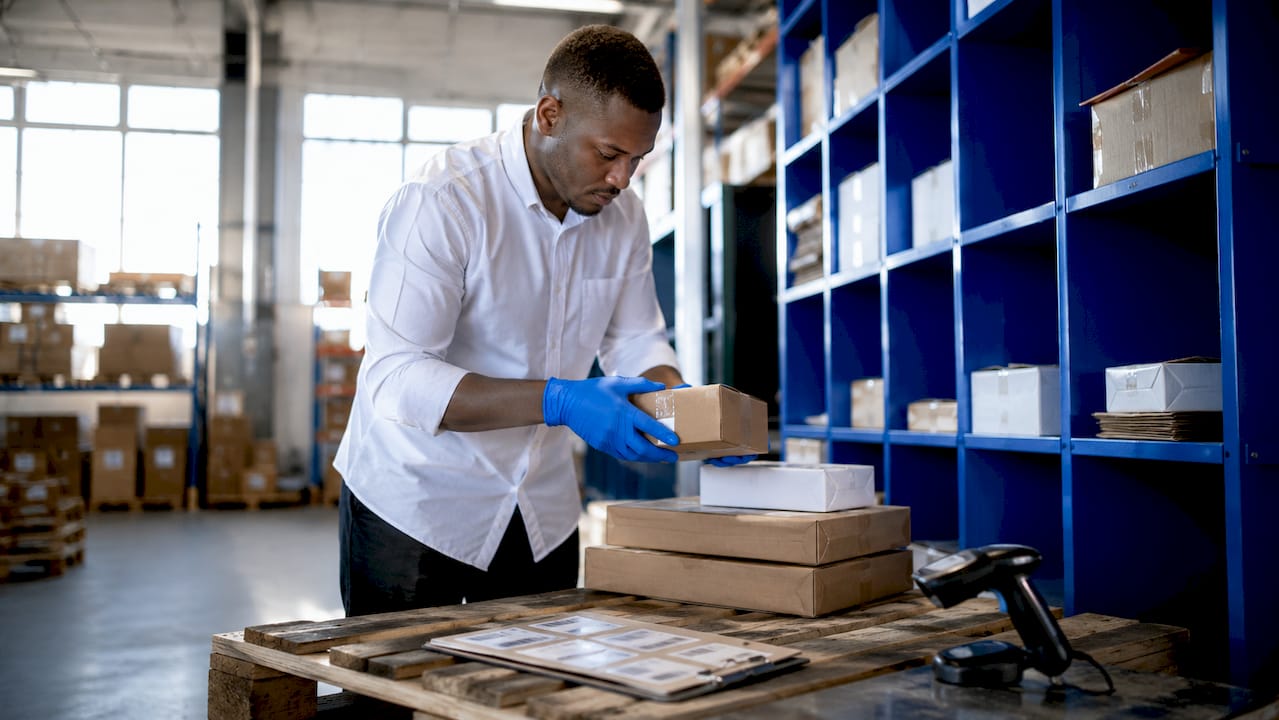 Warehouse worker sorting time-critical packages