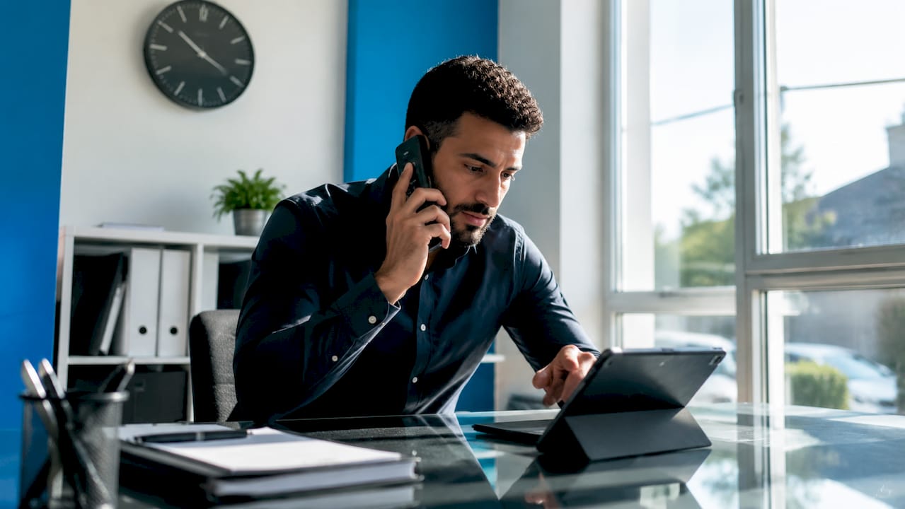 Logistics manager handling urgent delivery call
