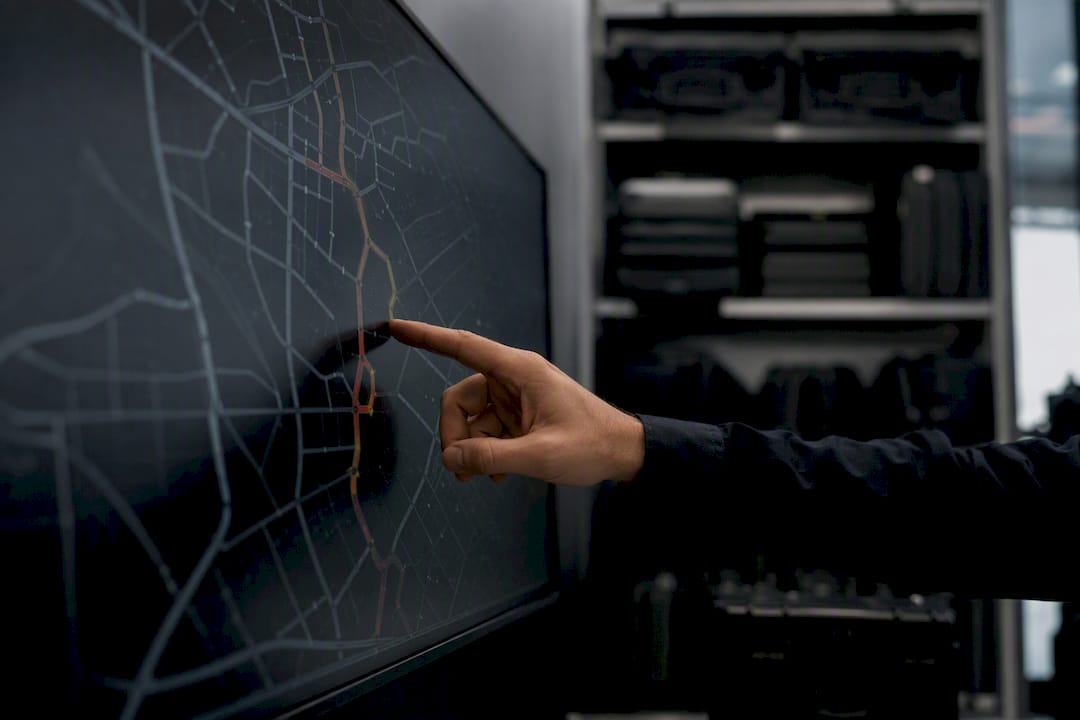 Hand pointing at traffic-aware routing map