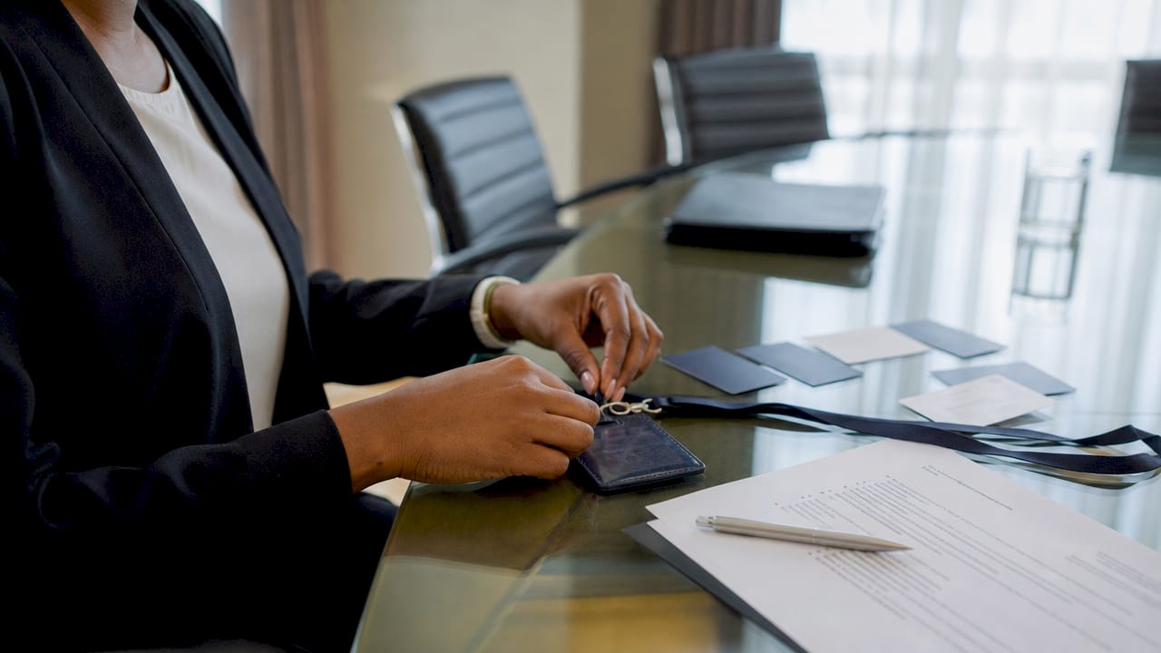 Hands setting up MFA hardware token for hotel staff