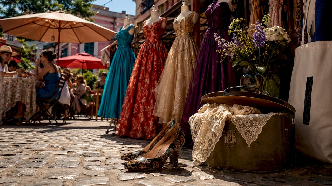 Showroom display of vintage formal dresses on mannequins