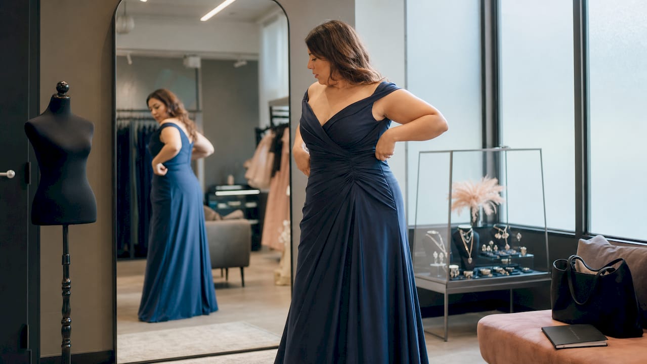 Plus size woman fitting formal dress