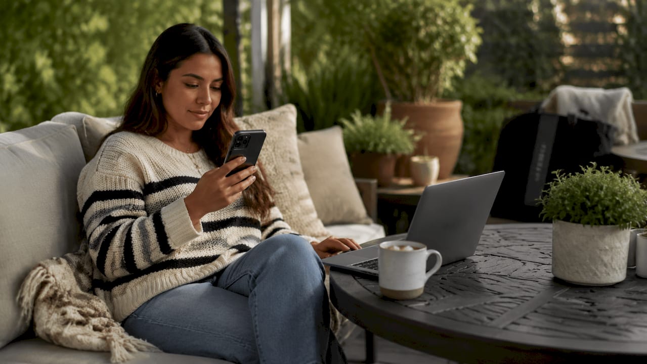 Woman using smartphone to check dress sale alerts