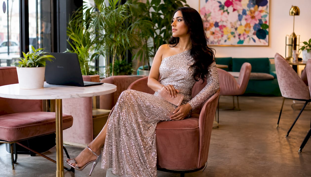 Woman styling sequin dress with matte accessories