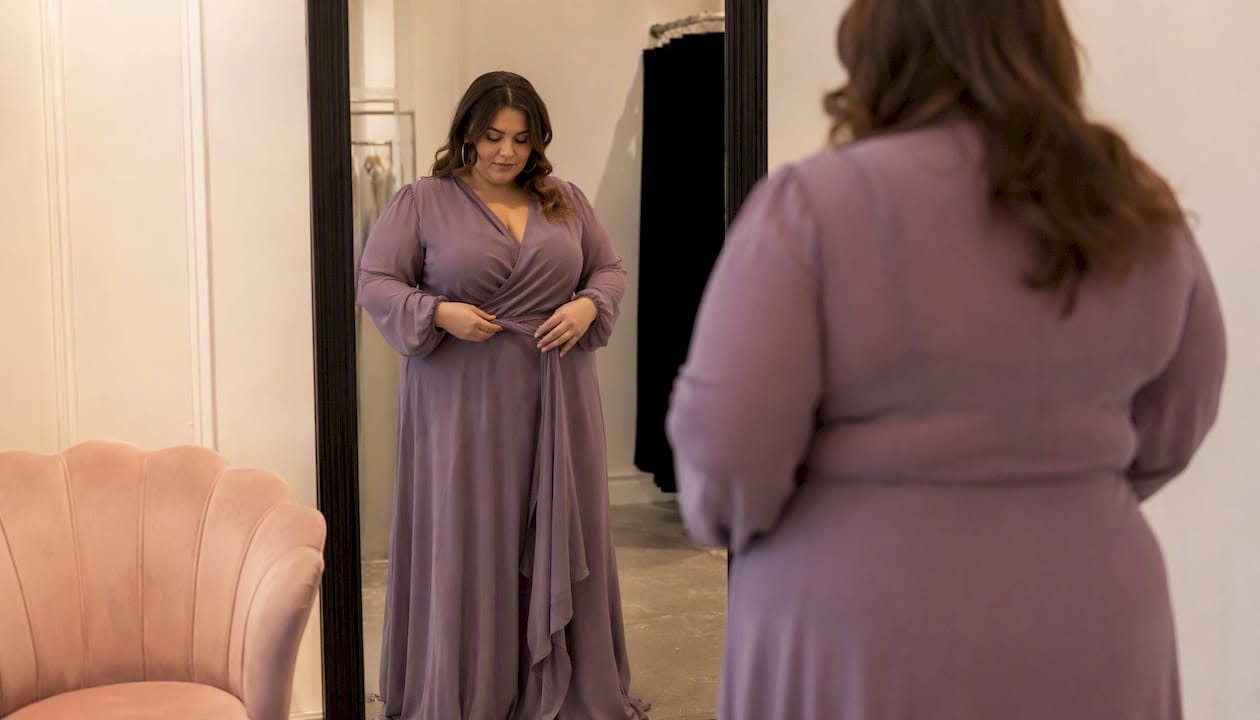Woman tying wrap gown belt