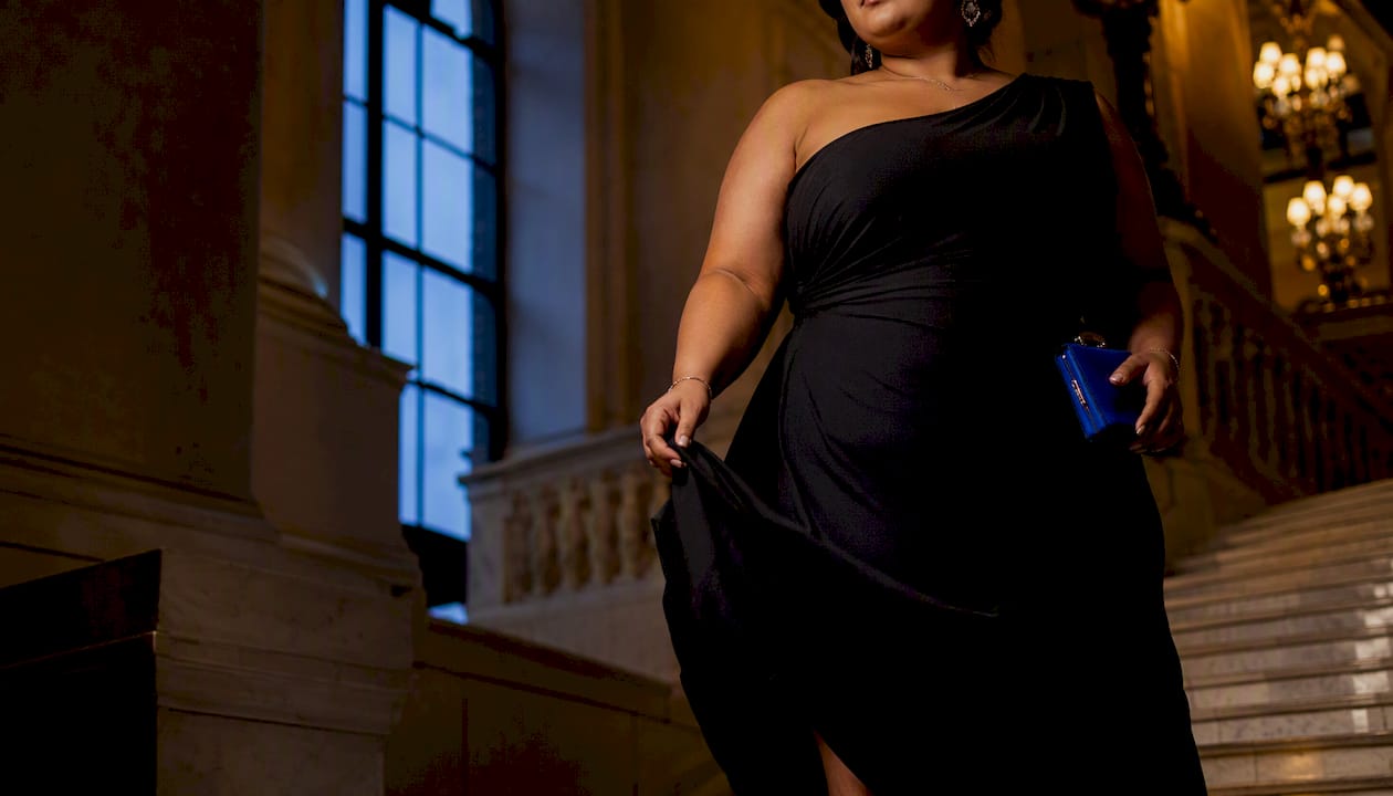 Plus-size woman in black gala silhouette