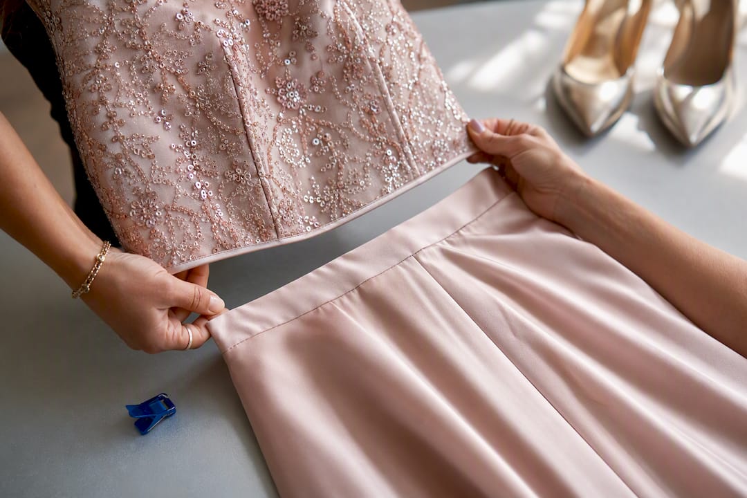 Close-up of two-piece dress fitting