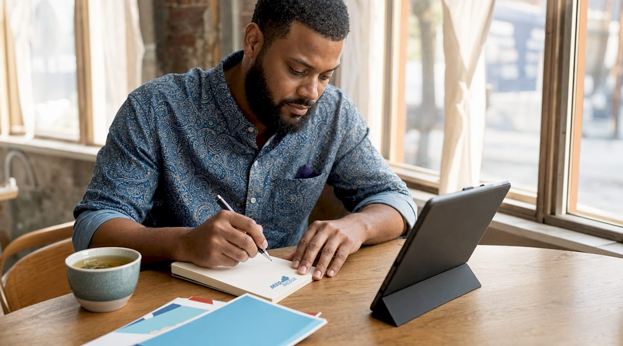 Marketer taking notes in coworking space