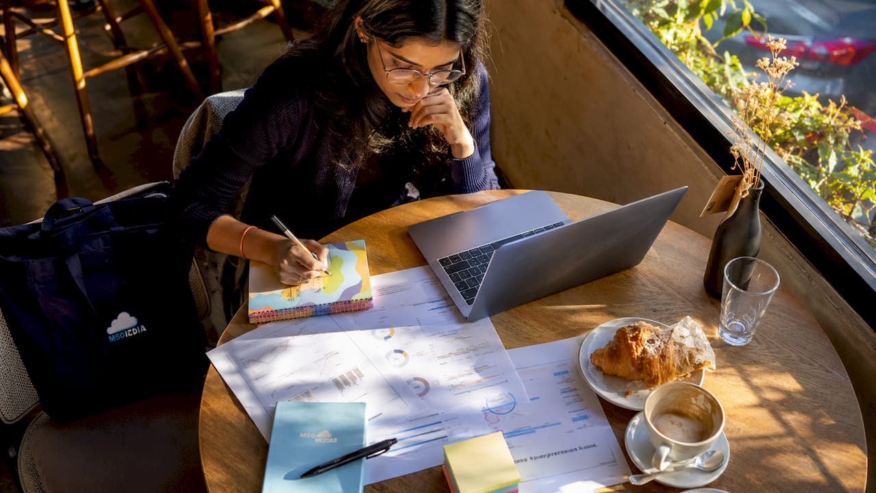 Woman conducting SEO technical audit at laptop
