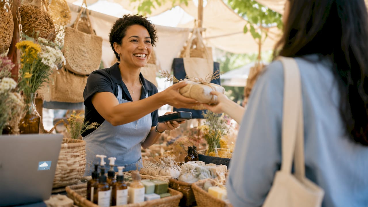 Small business owner cross-selling products to customer