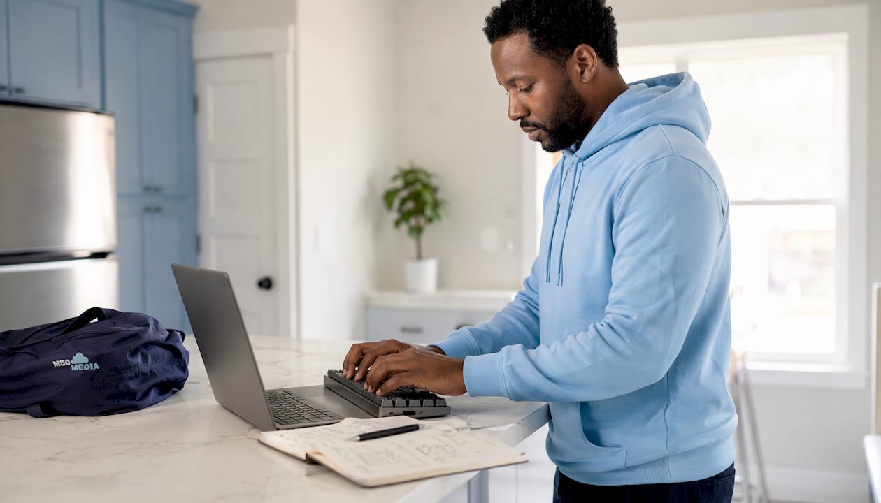 Hands typing positive online reputation content