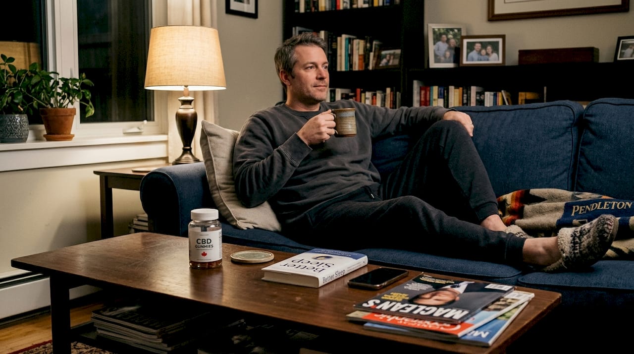 Man relaxing with CBD gummies for sleep
