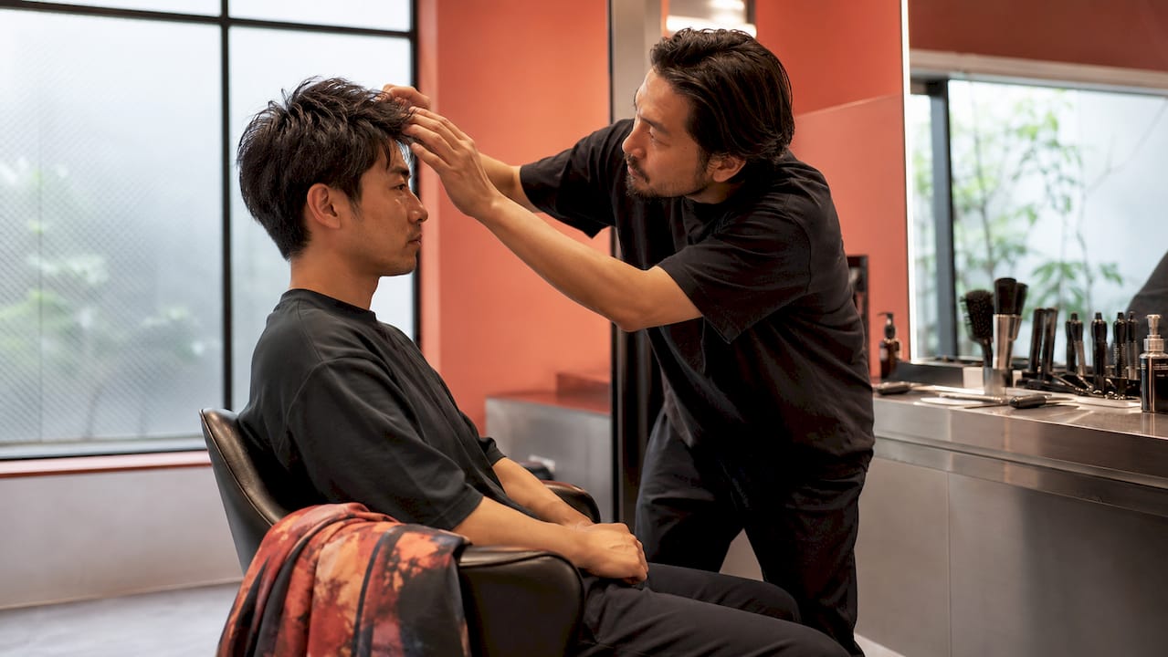 Man consulting stylist in hair studio
