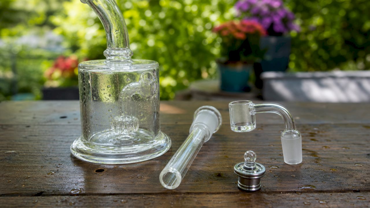 Close-up of dab rig parts on neutral table