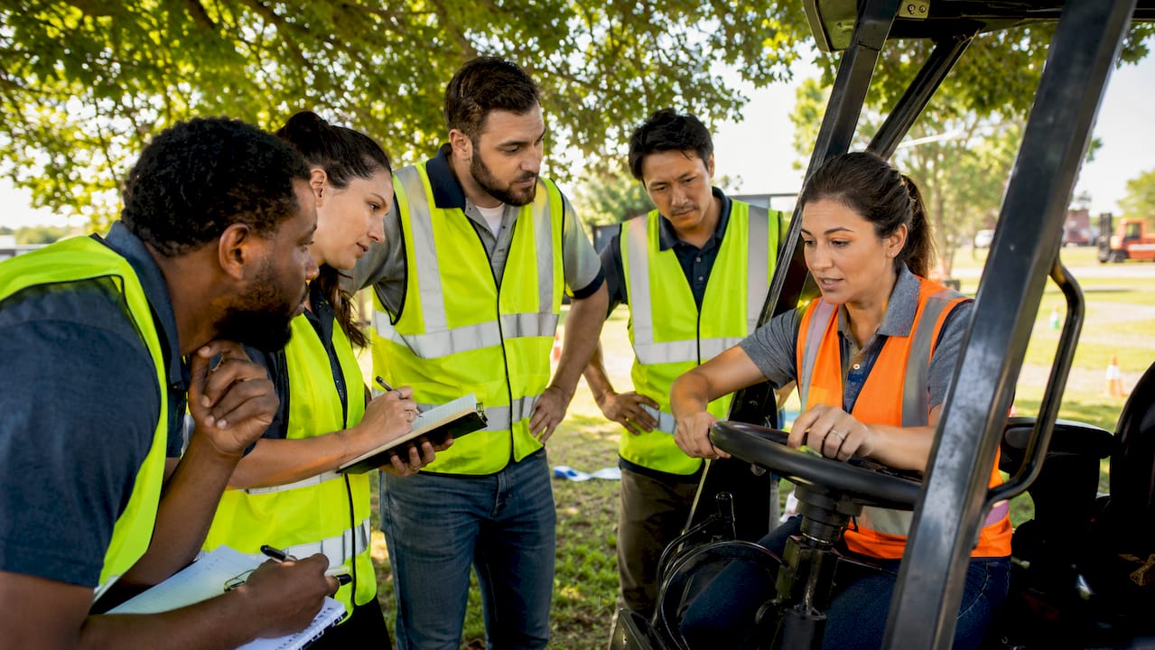 Group forklift training session onsite in warehouse