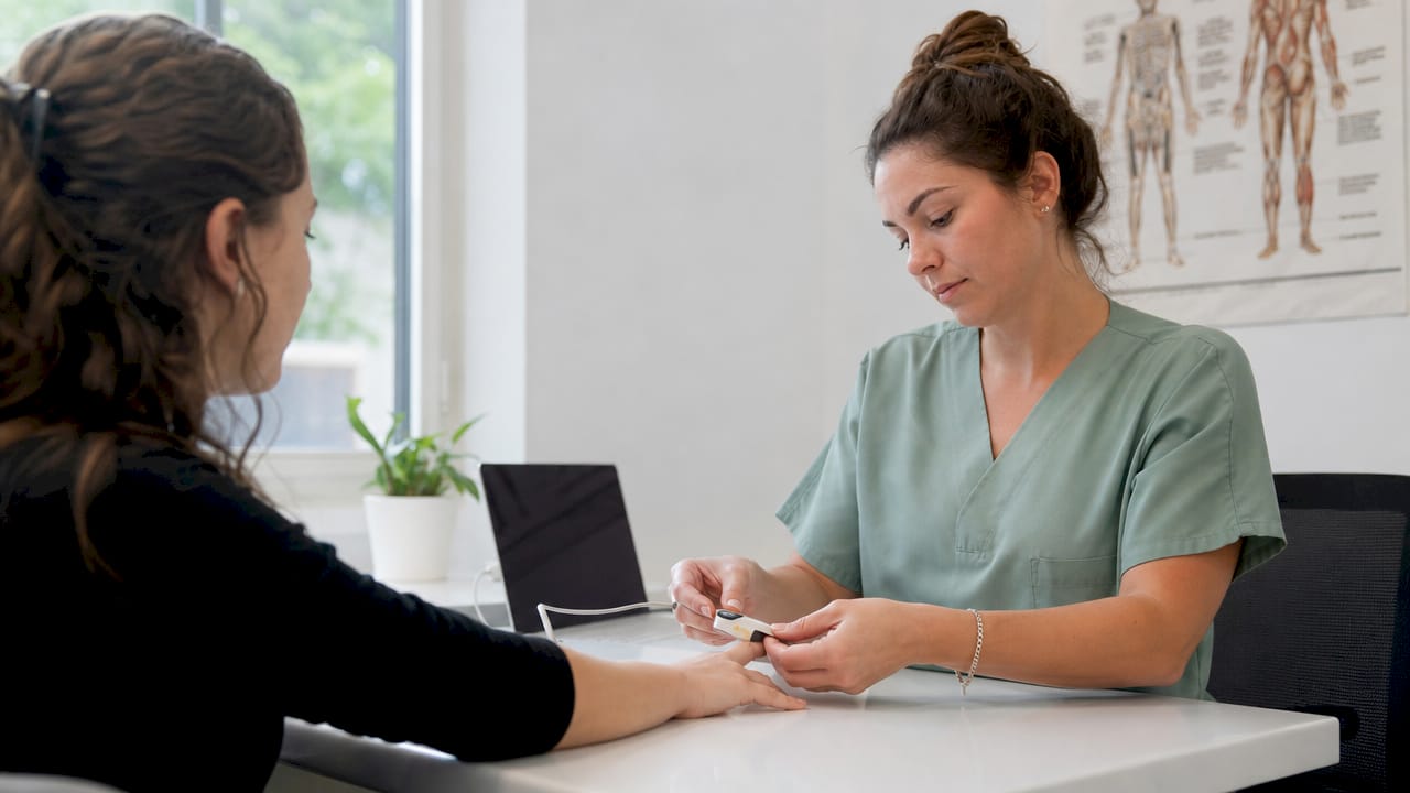 Medical researcher measuring patient body response