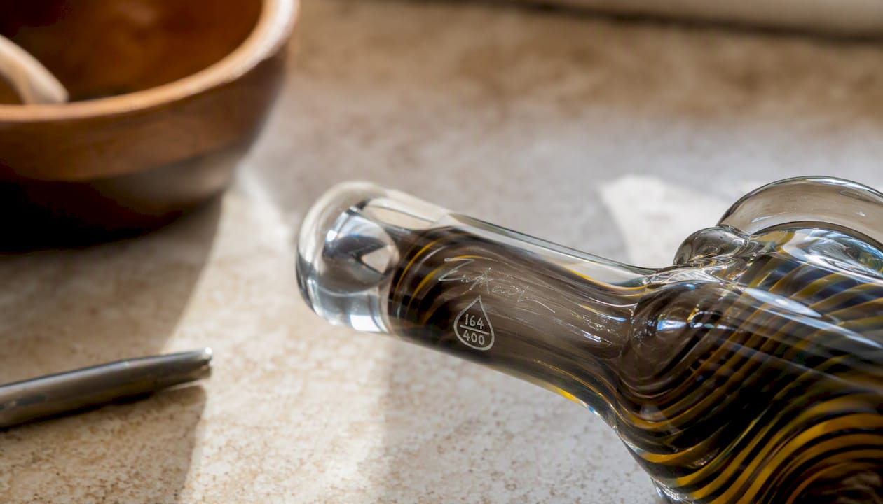 Etched signature on glass pipe neck