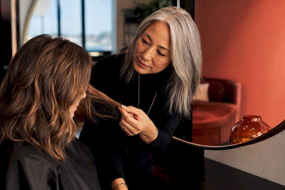 Colorist consulting client in salon