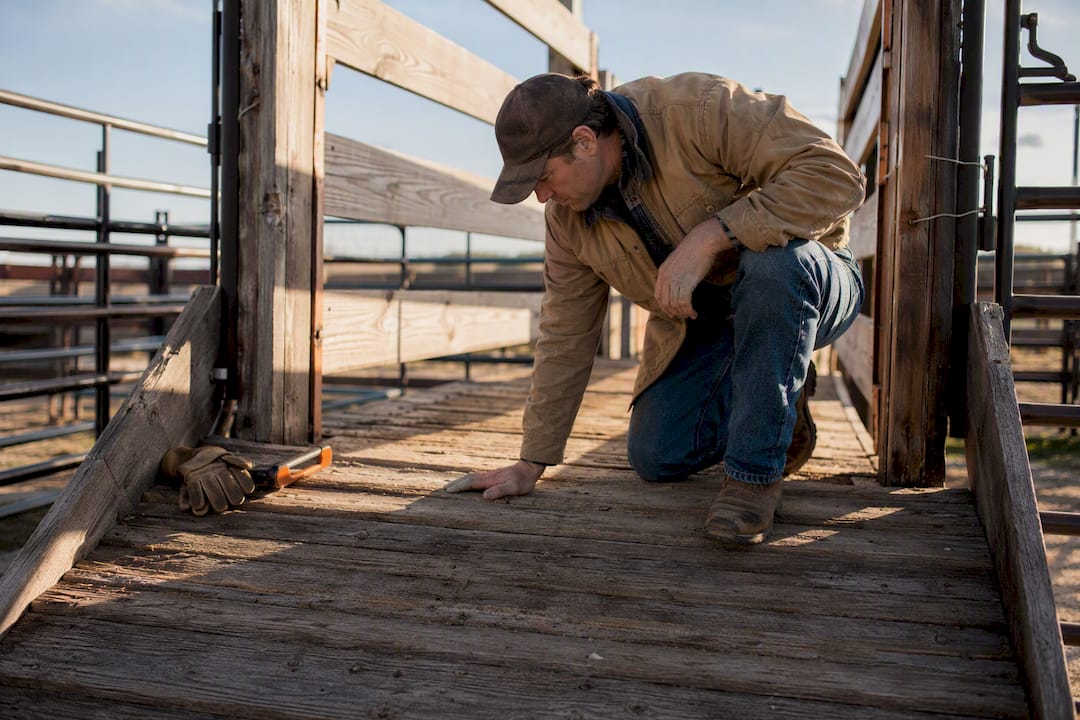 Rancher checking livestock loading ramp footing