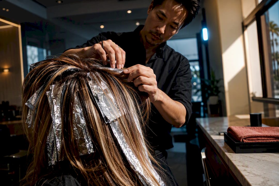 Foil highlights being sectioned in salon