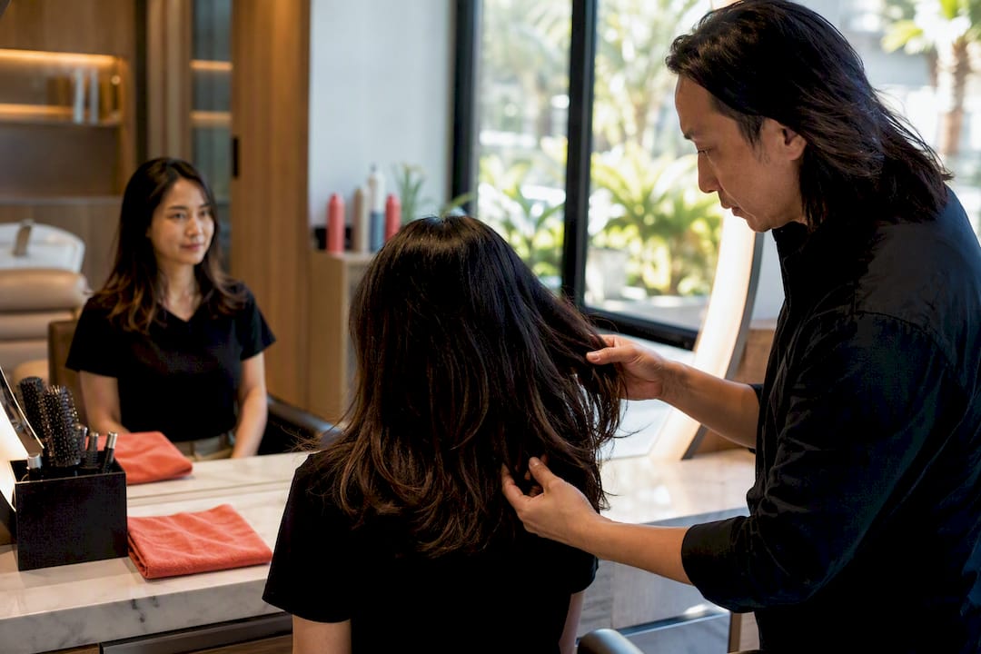Stylist conducting a personalized hair consultation