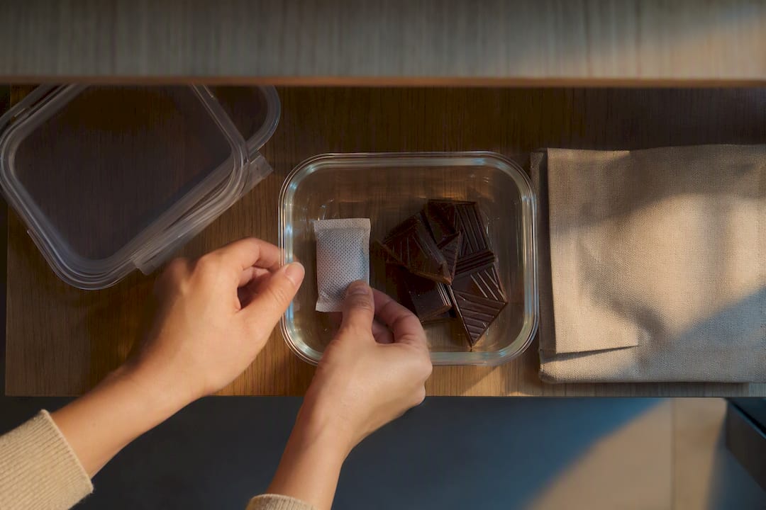 Silica packet beside stored chocolate