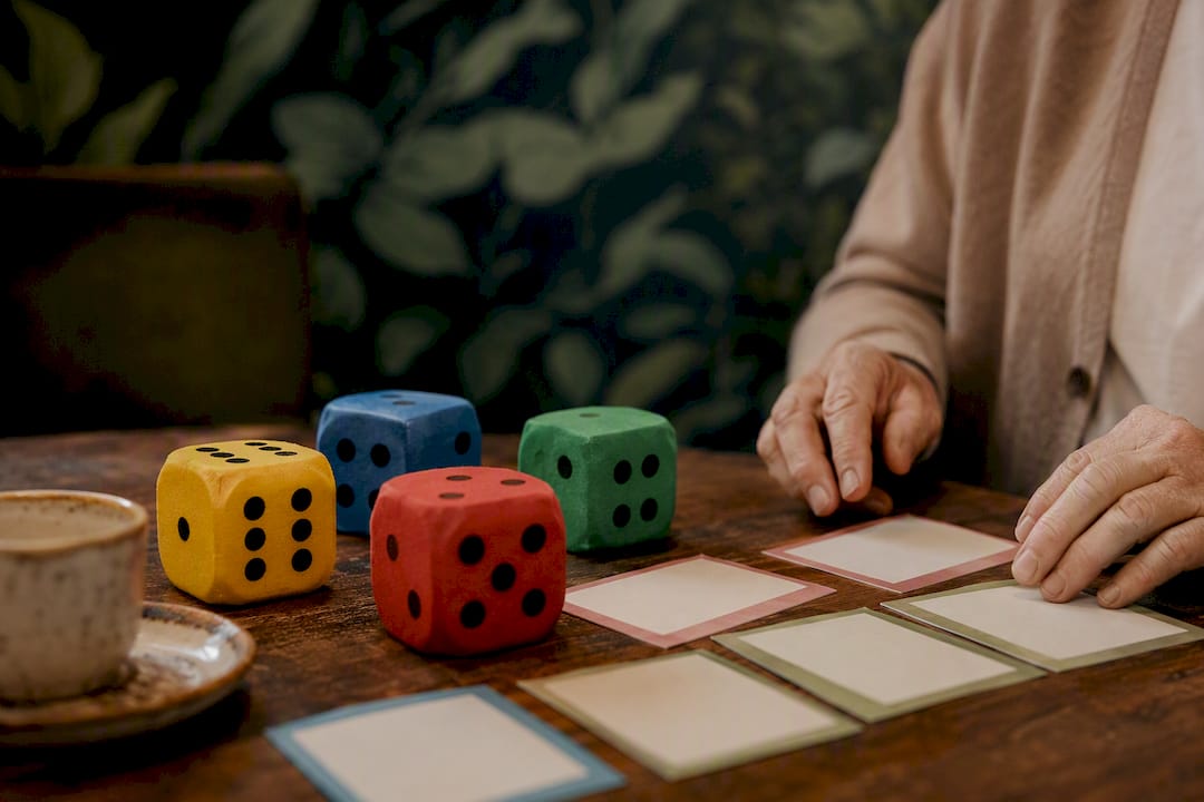 Oversized dice and flat cards on table