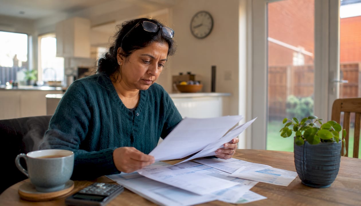 Homeowner reviewing HVAC energy savings documents
