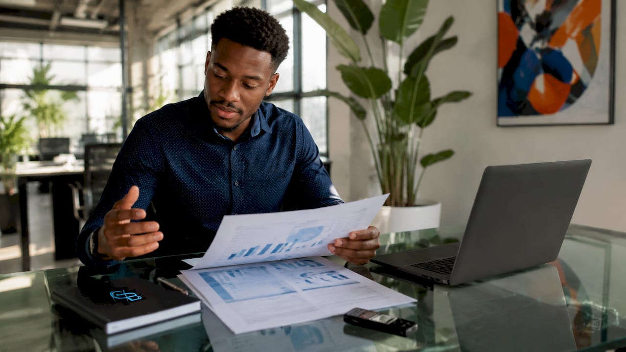 Insurance agent reviewing prospect list on phone