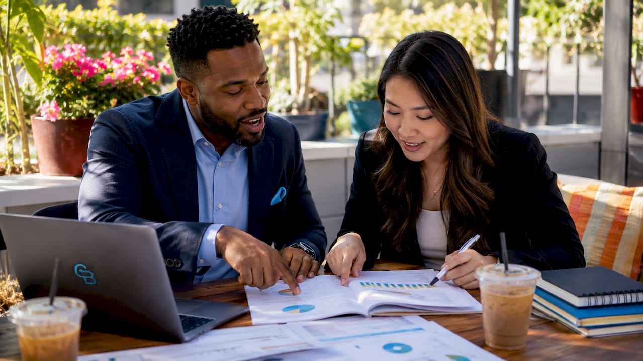 Two insurance agents discussing marketing automation tools