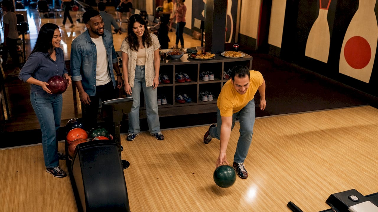 Friends enjoying casual bowling night