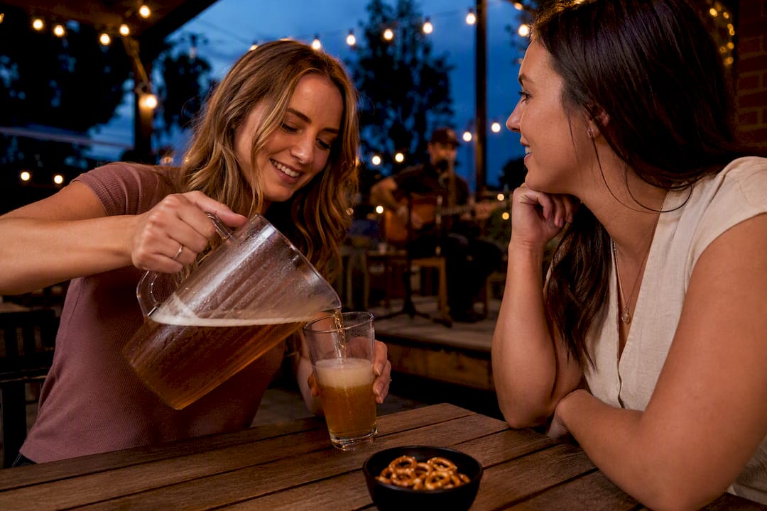 Friends sharing beer on a patio