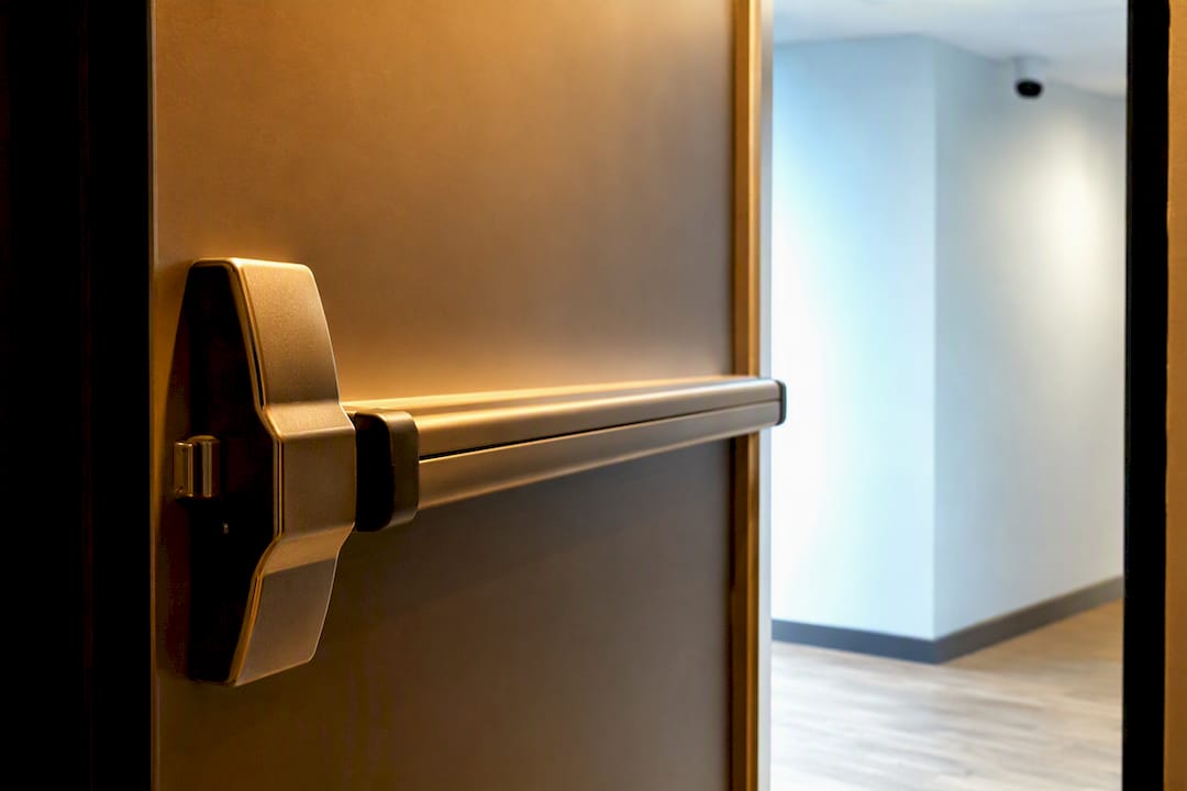 Emergency release bar on escape room door