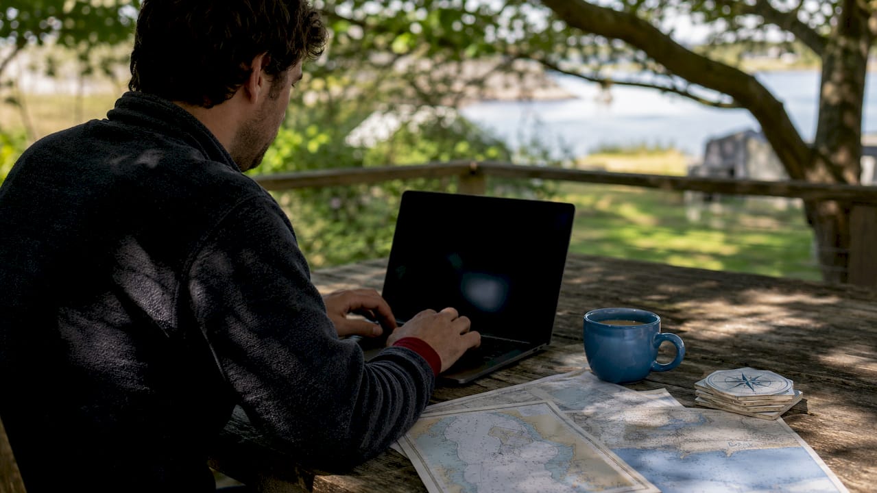 Hands typing on laptop checking name availability