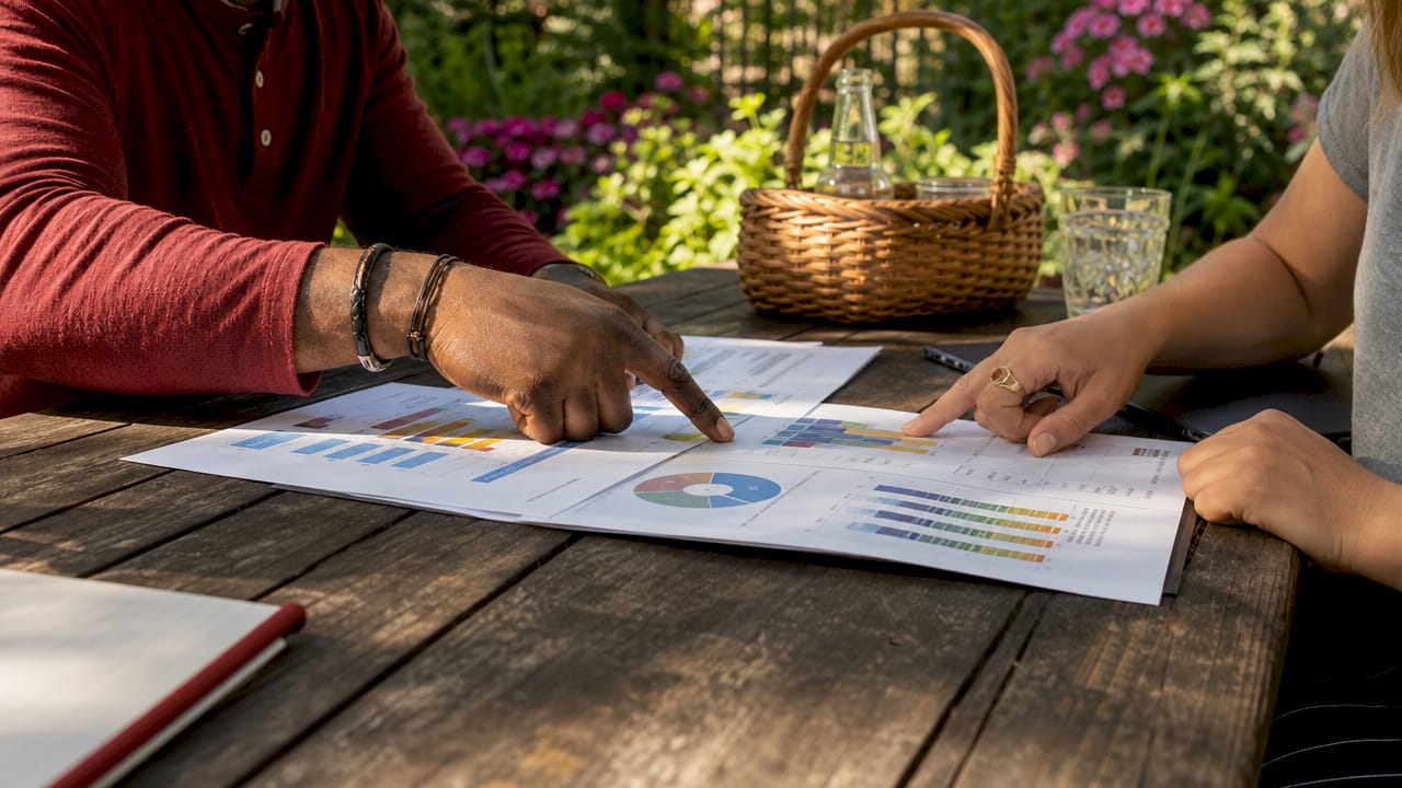 Hands pointing at insurance coverage documents