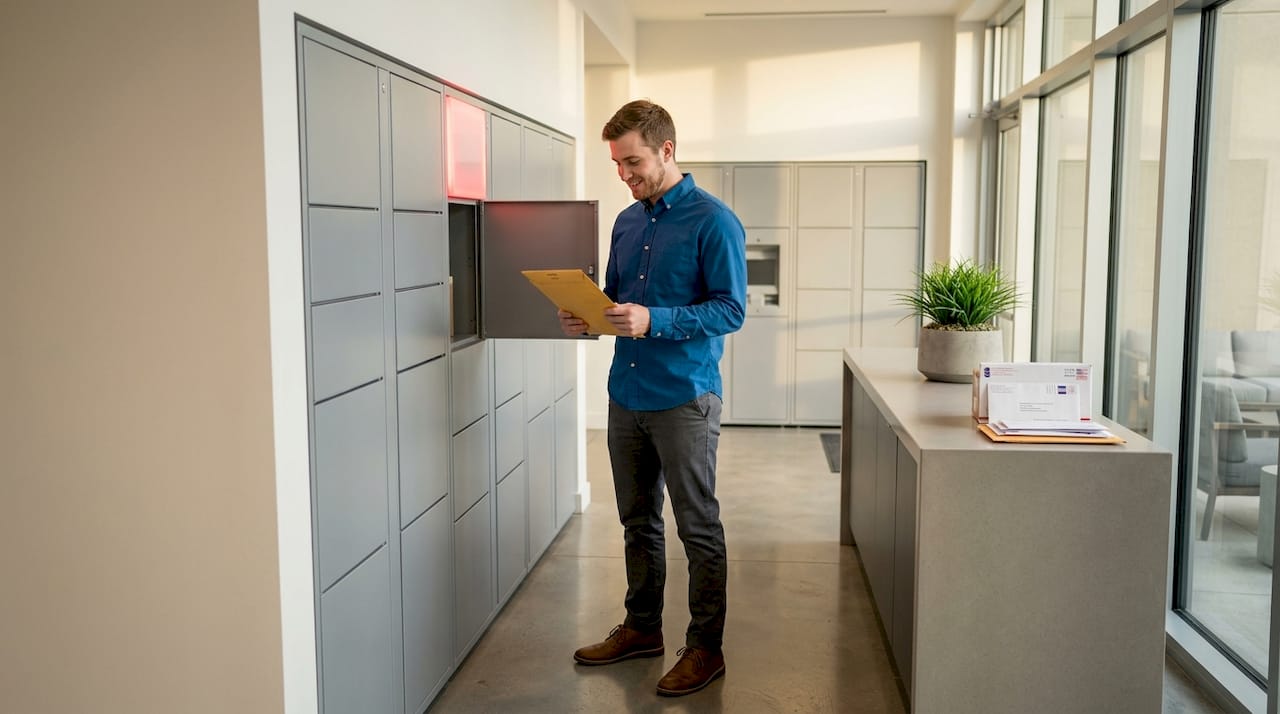 Resident retrieving parcel from building lockers
