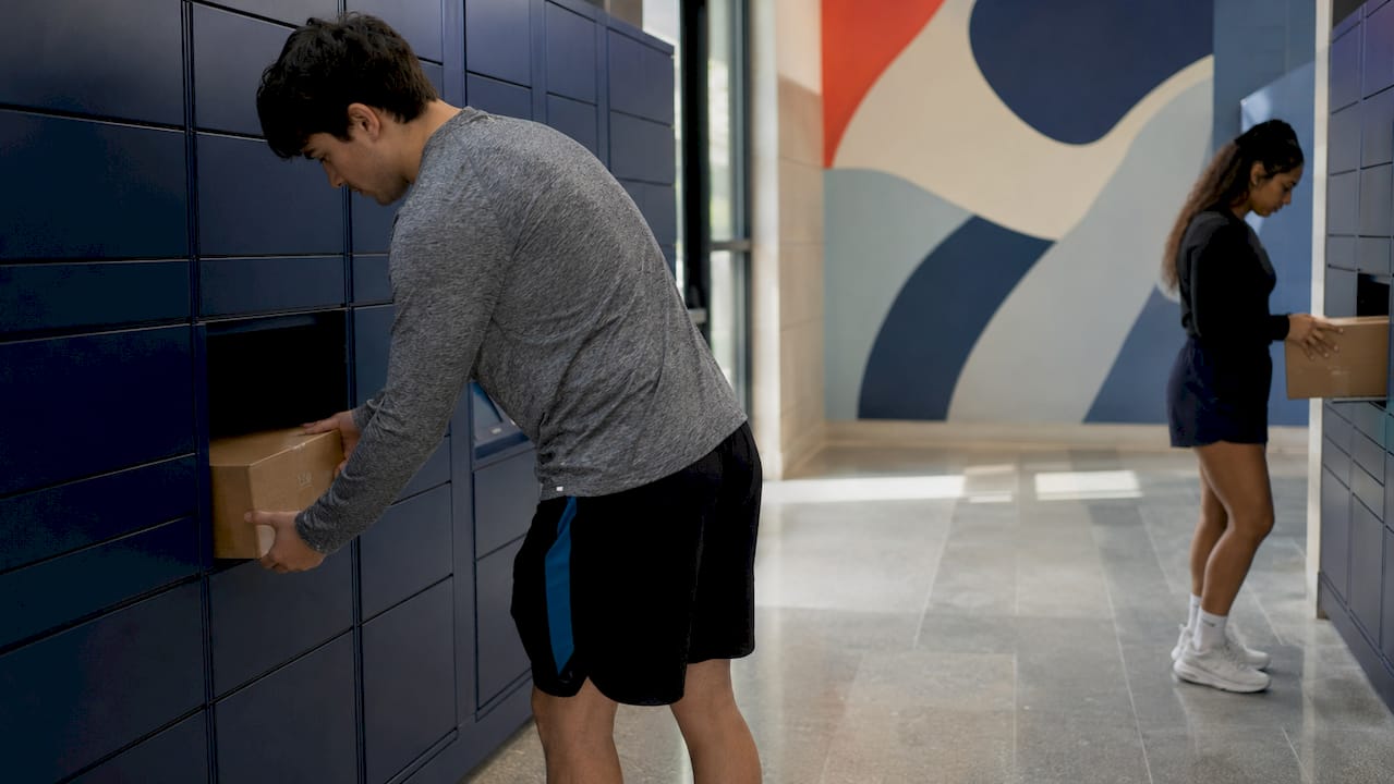 Students retrieving packages from parcel lockers