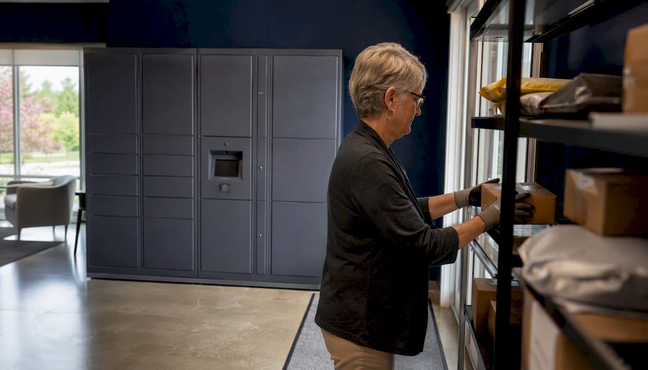 Senior living package room with lockers and parcel shelving