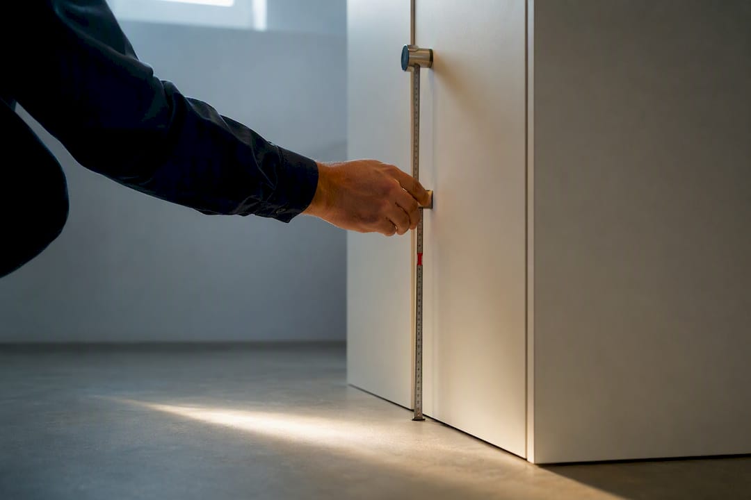 Architect measuring accessible locker reach